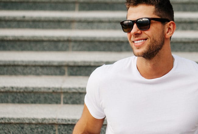 Confident smile after receiving crowns & bridges treatment.